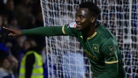 Mustapha Bundu celebrates scoring against Leicester City