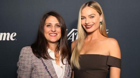 Pam Abdy, Co-Chair & CEO of Warner Bros Motion Picture Group, with actress Margot Robbie