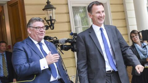 Jeremy Hunt, right, with Timo Soini of Finland