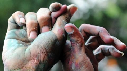 Members of the transgender, gay and lesbian communities hold hands during a rally to celebrate an Indian court's ruling to decriminalise gay sex between consenting adults