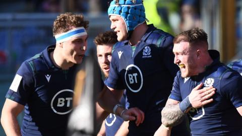 Scotland celebrate their opening try against Italy, scored by Stuart Hogg