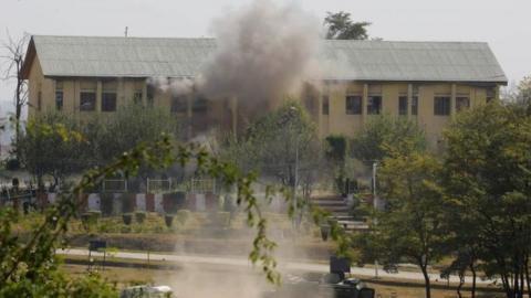 Smoke and dust rises from an Indian Border Security Force (BSF) building, that was held by suspected militants, after it was hit by explosives fired by government forces in Srinagar on October 3, 2017.