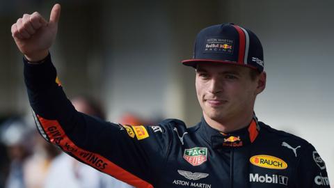 Red Bull"s Dutch driver Max Verstappen waves after taking pole position for the F1 Brazil Grand Prix in the qualifying session at the Interlagos racetrack in Sao Paulo