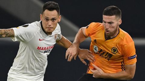 Sevilla's Lucas Ocampos (left) and Wolves' Matt Doherty (right) challenge for the ball during their Europa League quarter-final