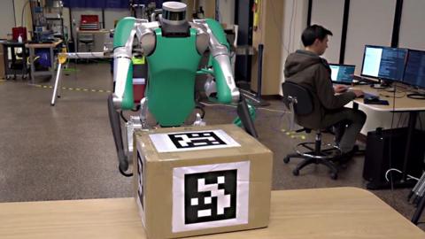A robot holding a box
