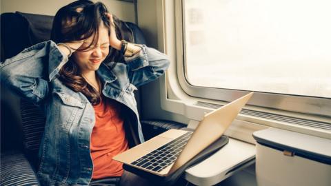 Stressed woman on train