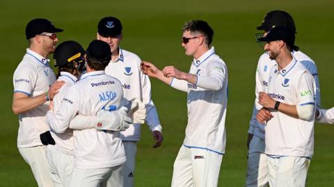 Sussex off-spinner Jack Carson celebrates a wicket