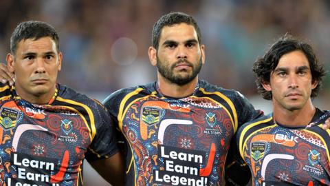 Justin Hodges, Greg Inglis and Johnathan Thurston during the national anthem before an Indigenous All Stars match