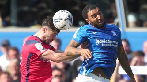 Hughes and Deeney challenge for the header