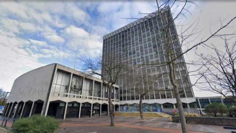 The Civic Centre in Southend - a multi-storey building with mainly glass facade and smaller concrete structure alongside