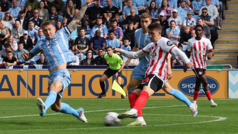 Dan Neil shoots for Sunderland but it is saved