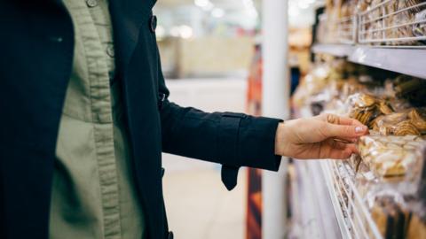 Person looking at cookies on shelf