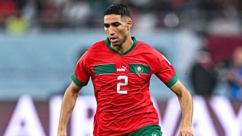 Moroccan defender Achraf Hakimi playing at the 2022 FIFA World Cup in Qatar where Morocco reached the semi-finals.