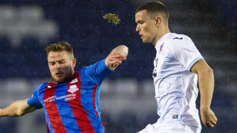 Raith's Ross Matthews is tackled by Scott Allardice