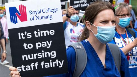 NHS workers and supporters take part in a protest march from University College Hospital to Whitehall in London on 3 July 2021