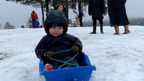 Theo sledging in Cofton Park, Birmingham