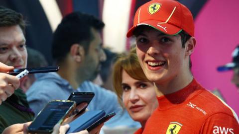 Oliver Bearman smiles while being interviewed after finishing seventh in the Saudi Arabian Grand Prix