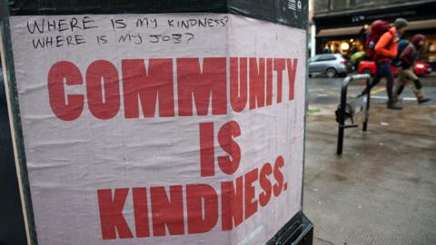 Community sign on lamppost