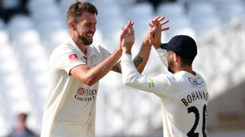 Tom Bailey celebrates taking his fourth wicket