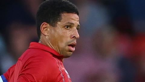 Curtis Davies playing for Cheltenham during pre-season