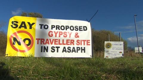 Photo of protest sign against Gypsy and Traveller site in St Asaph