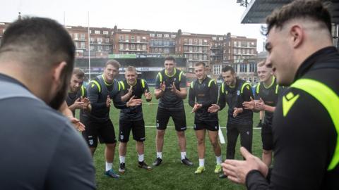 Cardiff gather for a team talk at an Arms Park training session