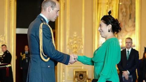 Ayette Bounouri receiving her Queen's Gallantry medal from the Prince of Wales