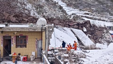 Rescuers search for survivors at the ruins of a landslide on January 22, 2024 in Zhenxiong County, Zhaotong City, Yunnan Province of China. The landslide has left 47 people buried on early January 22 in Zhaotong, Yunnan province