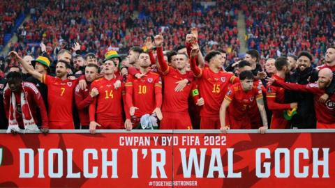 Welsh players celebrate reaching the World Cup for the first time since 1958