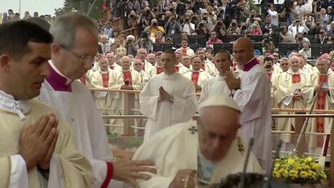 Pope Francis trips as he arrives for Holy Mass in southern Poland