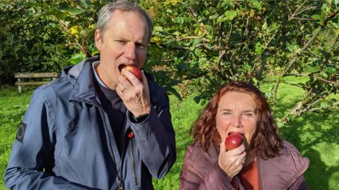 WODC councillors Andrew Prosser and Lidia Arciszewska stood at Deer Park's orchard in Witney