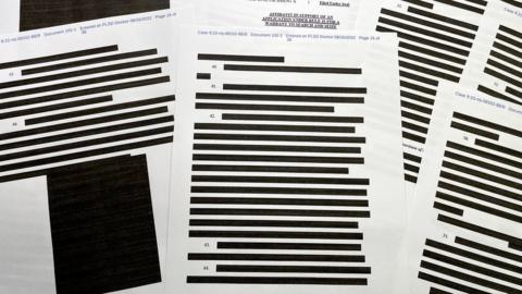 Of the 32 pages in the unsealed affidavit, 21 are mostly or entirely blacked out