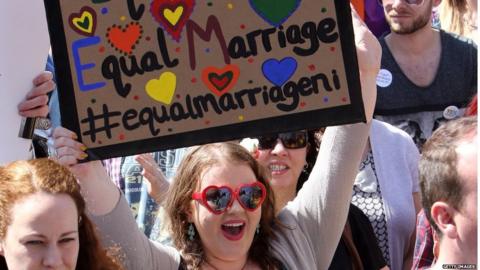 A sign from a pro-gay marriage march in Belfast saying: "equal love, equal marriage"