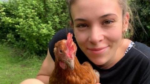 Triathlete Sophie Coldwell and one of her chickens