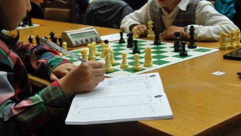 children practice chess