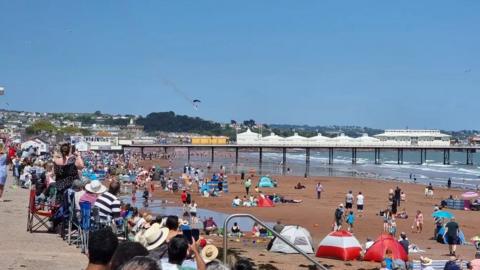 People on the beach watching the Torbay Airshow