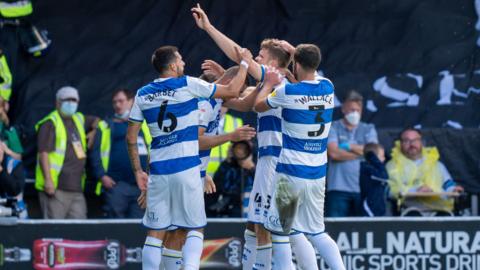 QPR celebrate their goal against Millwall