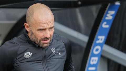 Derby County manager Paul Warne watched from the dugout as the Rams lose to Blackpool