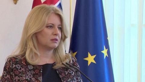 Slovak President Caputova standing at a microphone