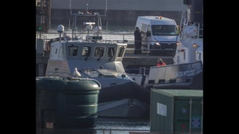 Border Force officers with migrants at Dover