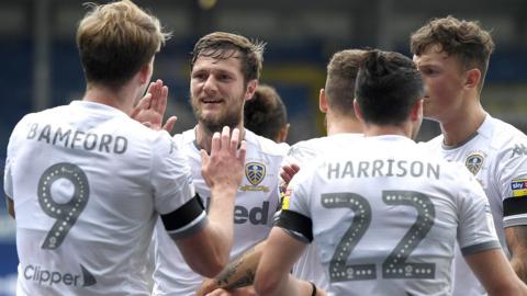 Leeds United players celebrate their winning goal against Barnsley