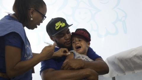 Child being vaccinated for swine flu in Rio de Janeiro, 25 April 16