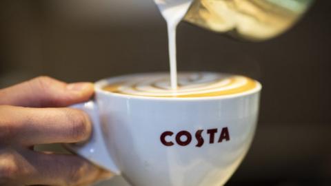 Milk being poured in to a Costa mug in-store