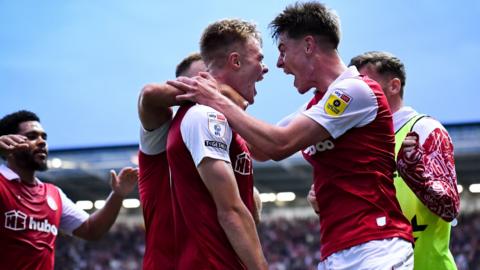 Tommy Conway of Bristol City celebrates scoring a goal with Alex Scott