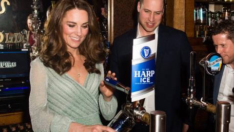 The Duke and Duchess of Cambridge pull a pint as they visit the Belfast Empire Hall in Belfast