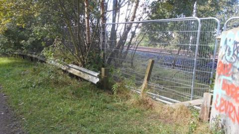 A section of fence near the railway line