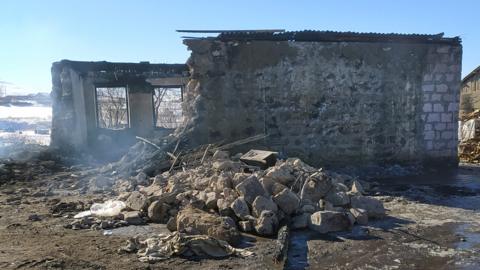 A burnt-out Armenian army barracks taken after a fire in the village of Azat, some 170kms east of Yerevan on January 19