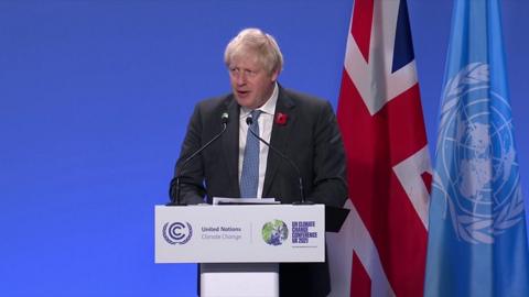 Boris Johnson at a podium.