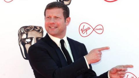 Dermot O'Leary posing on the red carpet at the Baftas