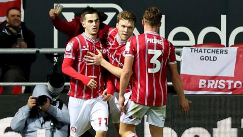 Anis Mehmeti (left) celebrates his goal with two team-mates